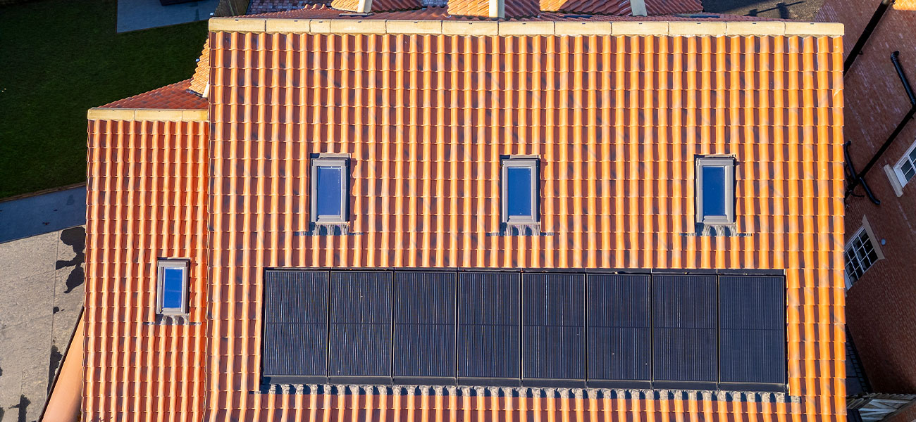 Marley clay interlocking roof tiles and solar panels installed on a residential home