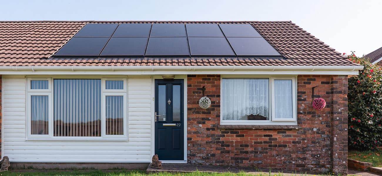 Marley solar panels and concrete roof tiles installed on a housing scheme bungalow
