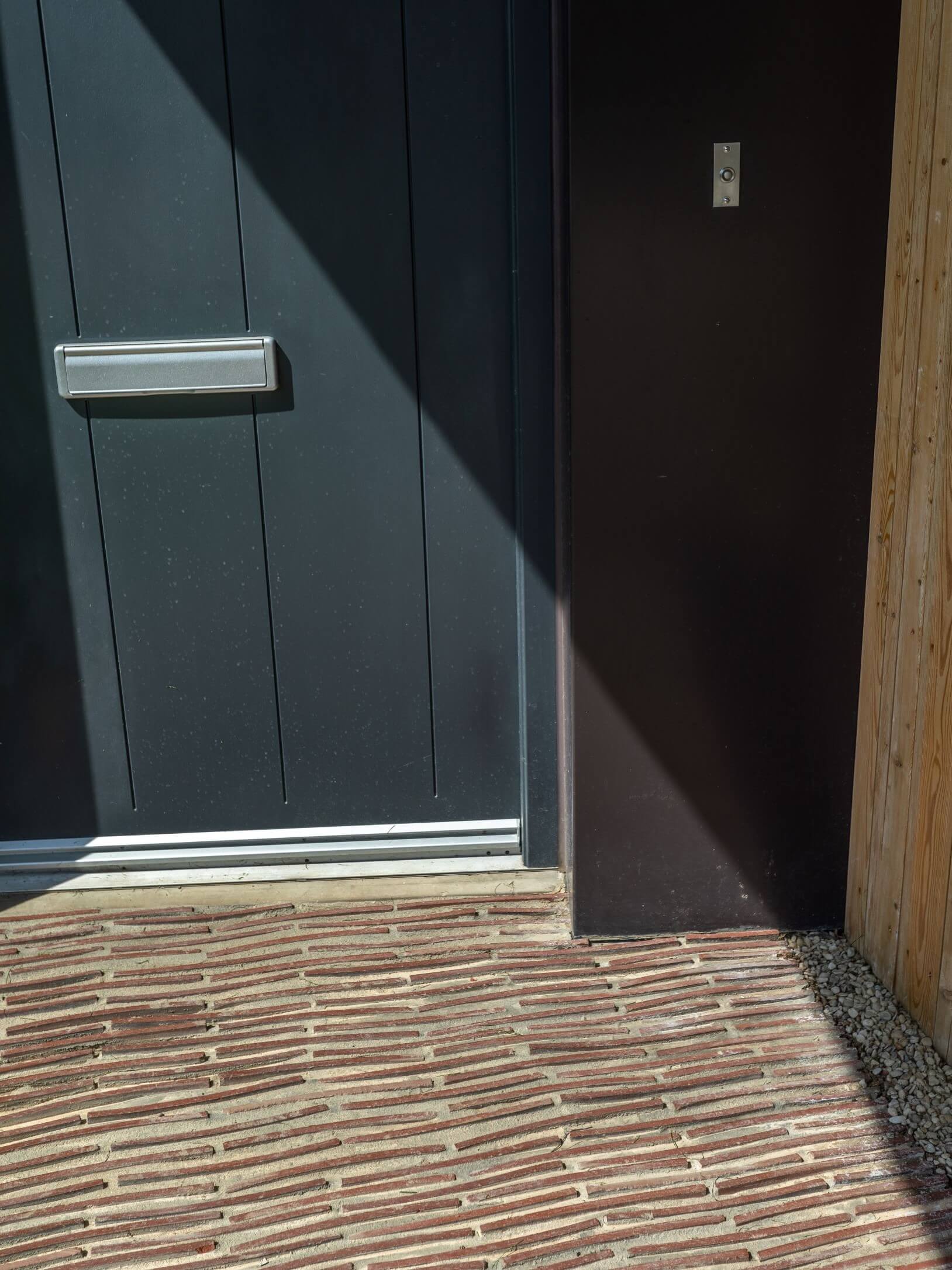 Marley clay plain roof tiles installed on roofing project Golden Mede close up of door