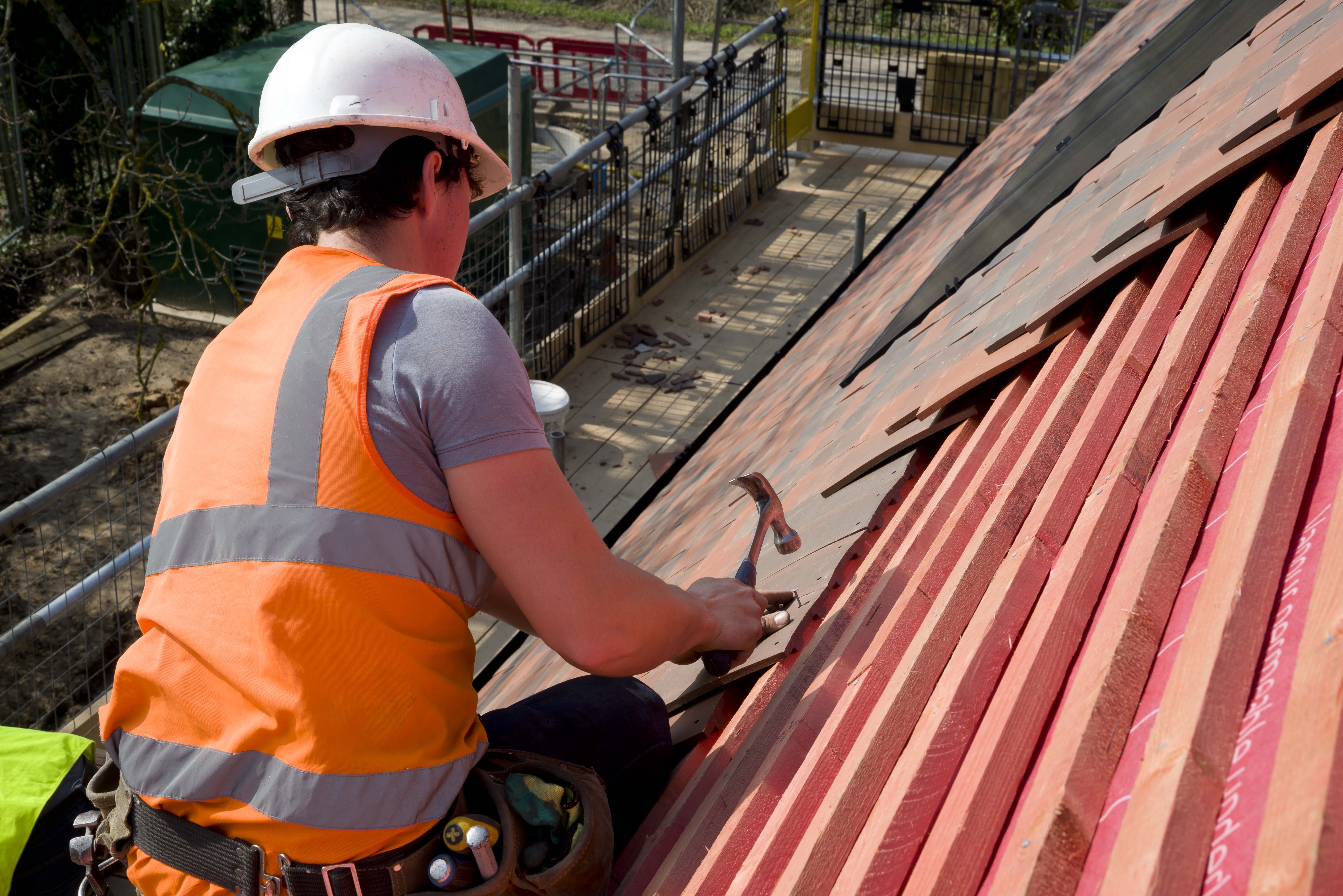 Roofer on site installing Marley full roof system
