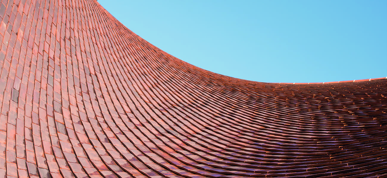 Close up view on the curved roof showing Marley Clay tile
