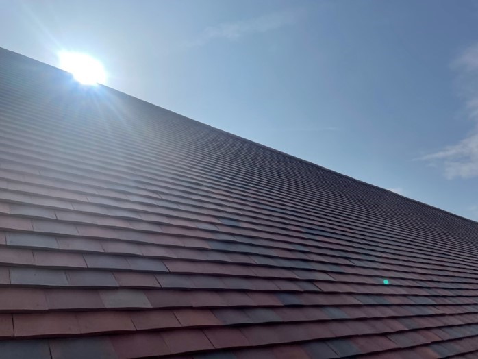 Close up of Stokeminster School using Marley Acme Double Camber roof tiles with sun shinning