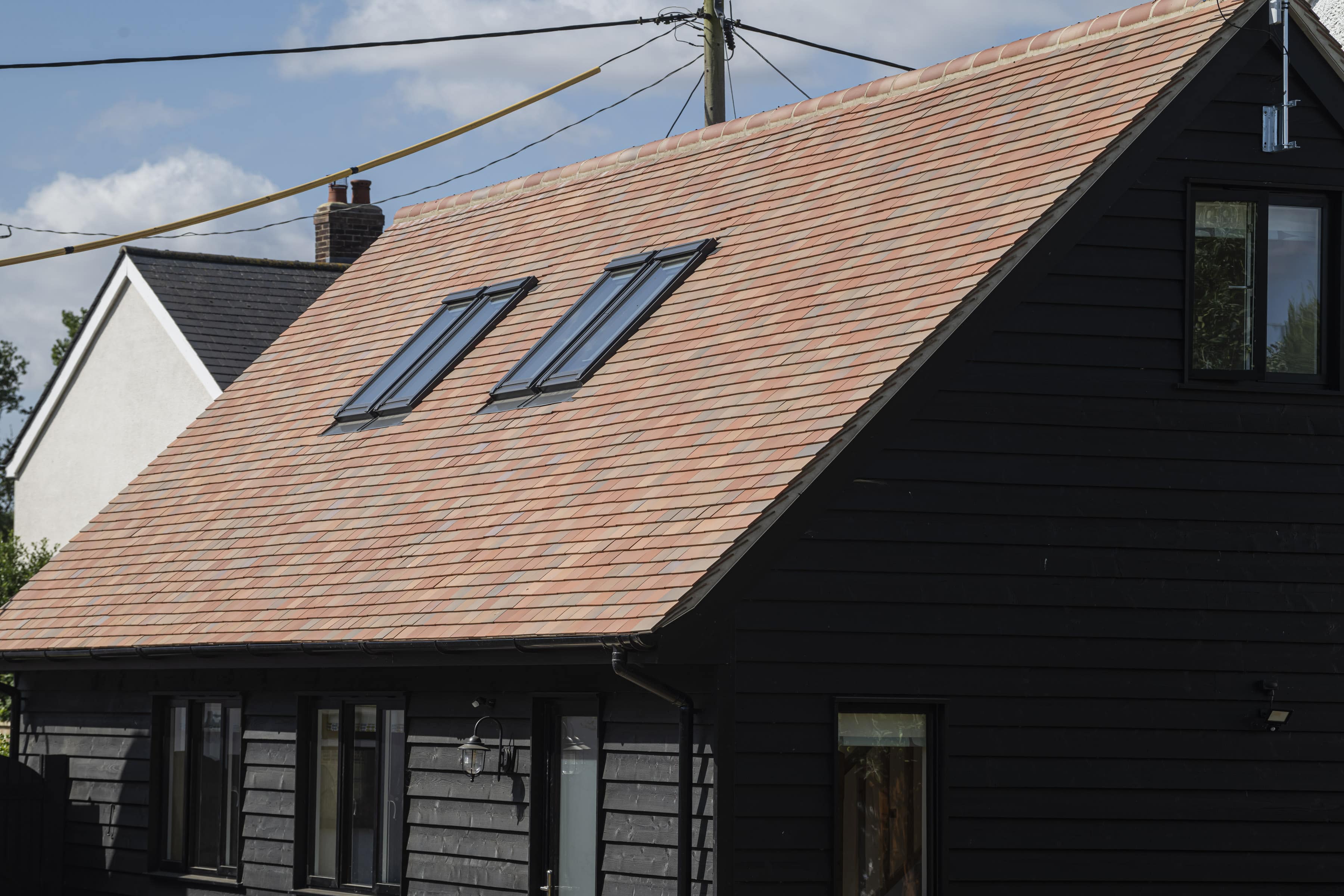 Marley acme single camber tiles in Autumn Brindle installed on a new annex building