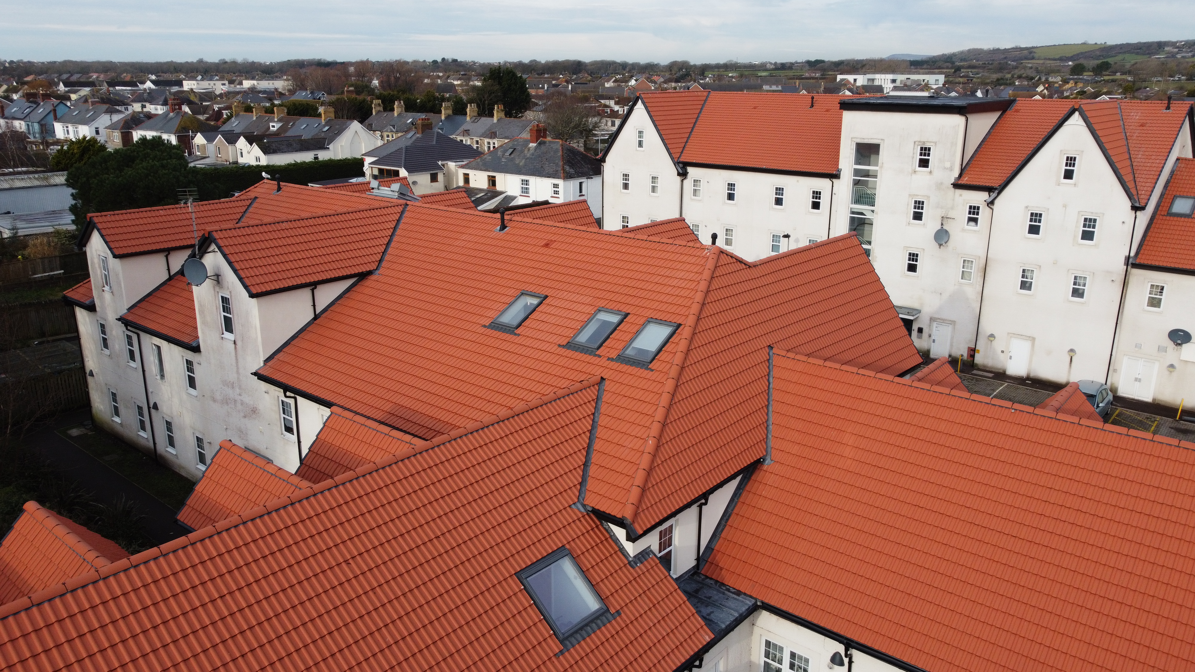 A close up of Marley double roman concrete roof tiles installed on a roof