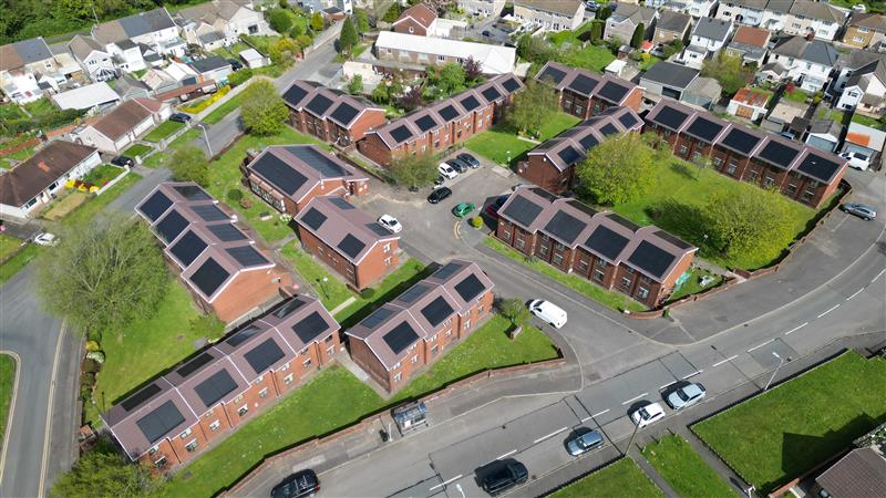 Marley solar panels and tiles on a social housing roof in Wales birds eye view