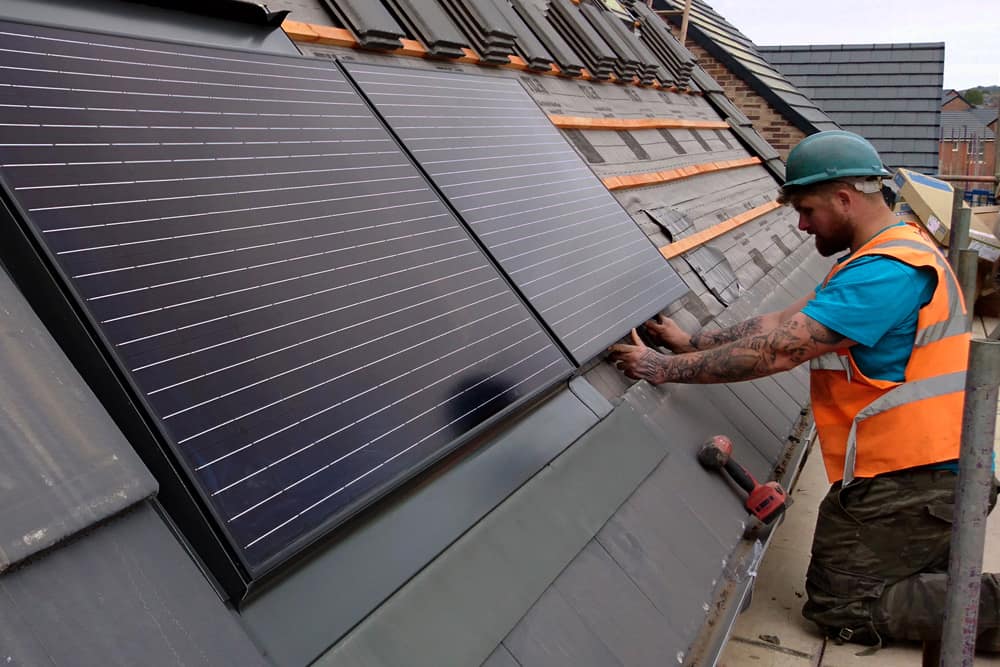 roofer installing solar panels