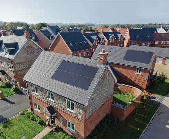 Solar panels on pitched roofs in housing development